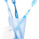 Glass with toothbrushes inside