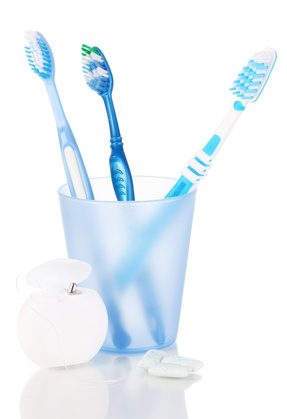 Glass with toothbrushes inside