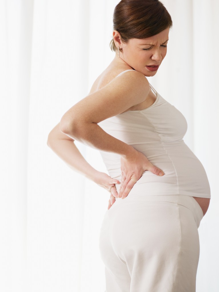 pregnant woman with back pain over-arching back