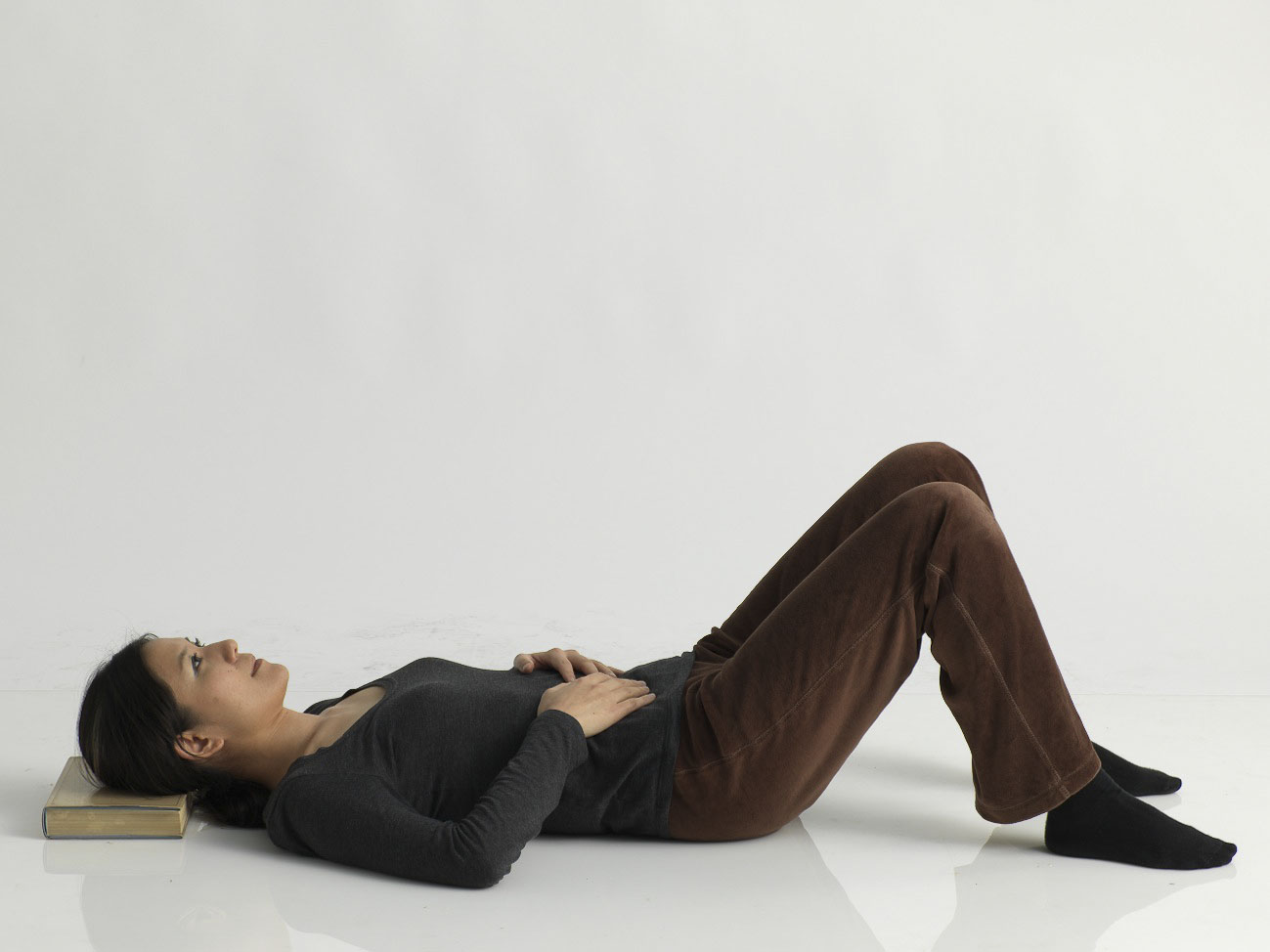 Lying down. Alexander Technique Mindfulness to rest the back and neck